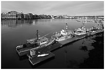 Deck, fishing boats, and river. Portsmouth, New Hampshire, USA (black and white)