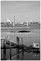 Small baot Bridges over Portsmouth river estuary. Portsmouth, New Hampshire, USA ( black and white)