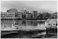 Fishing boat, shack, and waterfront buildings. Portsmouth, New Hampshire, USA (black and white)