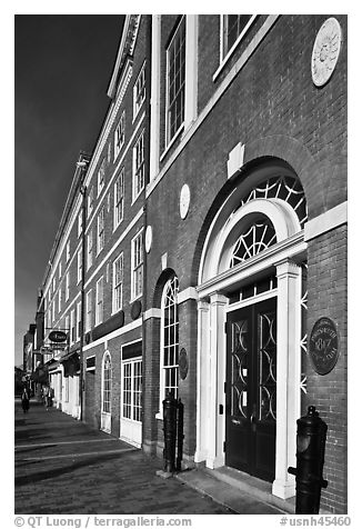 Sidewalk and row of brick buildings. Portsmouth, New Hampshire, USA (black and white)