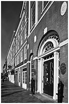 Sidewalk and row of brick buildings. Portsmouth, New Hampshire, USA (black and white)