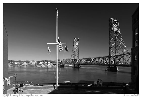 Riverside plaza, flagpole, and memorial bridge. Portsmouth, New Hampshire, USA (black and white)