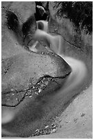 Water flowing over smooth granite, Franconia Notch State Park. New Hampshire, USA ( black and white)