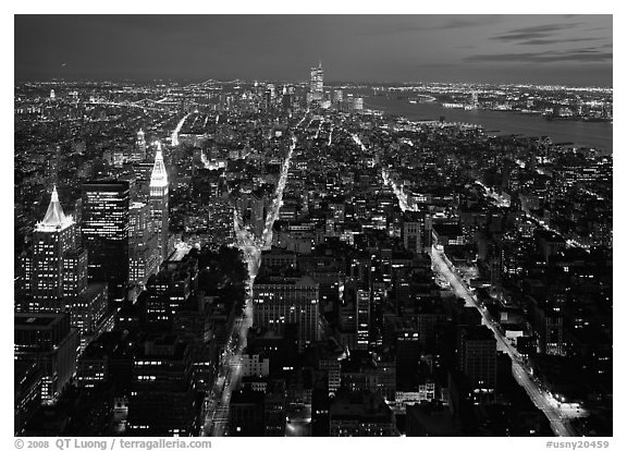 Streets at night from above with twin towers in background. NYC, New York, USA