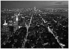 Streets at night from above with twin towers in background. USA ( black and white)