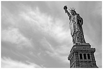 Statue of Liberty and pedestal against sky. NYC, New York, USA (black and white)