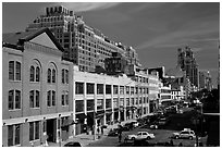 Taxi cars in streets and brick buildings. NYC, New York, USA (black and white)