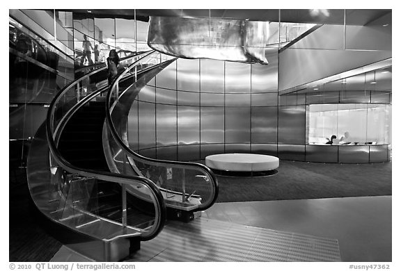 Curved moving staircase and meeeting room, Bloomberg building. NYC, New York, USA (black and white)