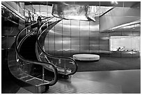 Curved moving staircase and meeeting room, Bloomberg building. NYC, New York, USA ( black and white)