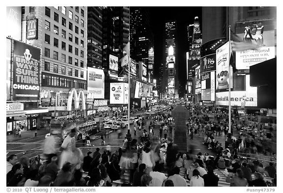 Crowds on Times Squares at night. NYC, New York, USA (black and white)