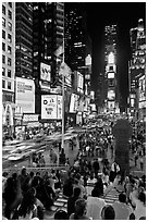 One Times Square at night and Francis Duffy monument. NYC, New York, USA (black and white)