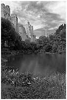 Central Park pond and nearby buildings. NYC, New York, USA (black and white)