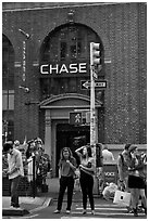 People waiting at crosswalk amidst bubbles. NYC, New York, USA ( black and white)