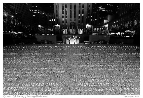 Rockefeller plaza and rink by night with Credo plaque. NYC, New York, USA (black and white)