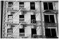 Residential building with emergency exit staircases. NYC, New York, USA (black and white)