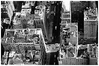 Canyon-like streets and yellow cabs seen from the Empire State building. NYC, New York, USA (black and white)