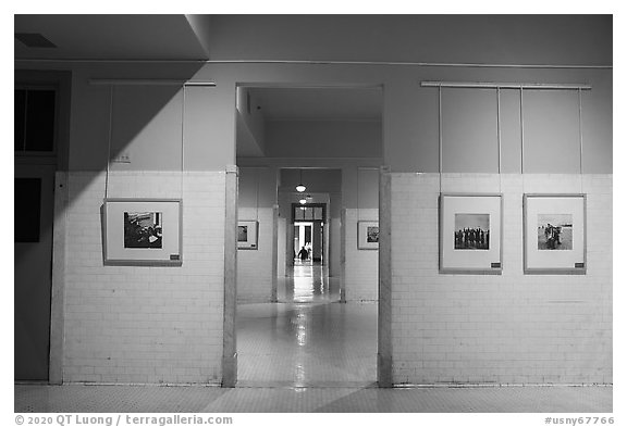 Side rooms with photography exhibit, Ellis Island, Statue of Liberty National Monument. NYC, New York, USA (black and white)