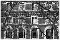 Trees and main building facade, Ellis Island, Statue of Liberty National Monument. NYC, New York, USA ( black and white)