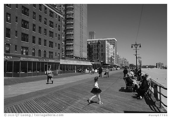 Appartment buildings, boardwalk, and beach, Coney Island. New York, USA