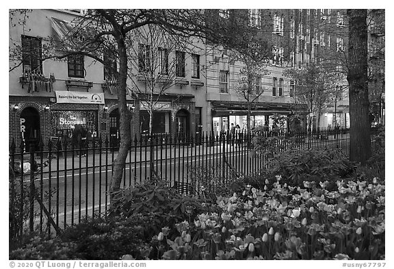 Christopher Park and Stonewall Inn across Christopher Street, Stonewall National Monument. NYC, New York, USA (black and white)