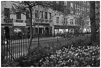 Christopher Park and Stonewall Inn across Christopher Street, Stonewall National Monument. NYC, New York, USA ( black and white)