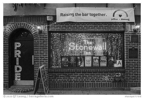 Stonewall Inn facade at dusk, Stonewall National Monument. NYC, New York, USA (black and white)