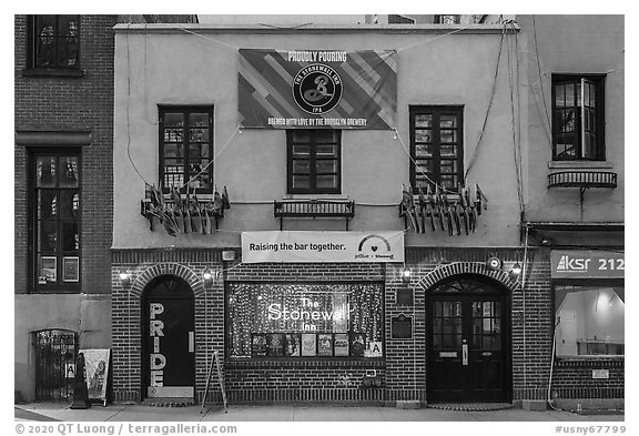 Stonewall Inn building facade with gay pride flags. NYC, New York, USA (black and white)
