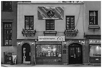 Stonewall Inn building facade with gay pride flags. NYC, New York, USA ( black and white)