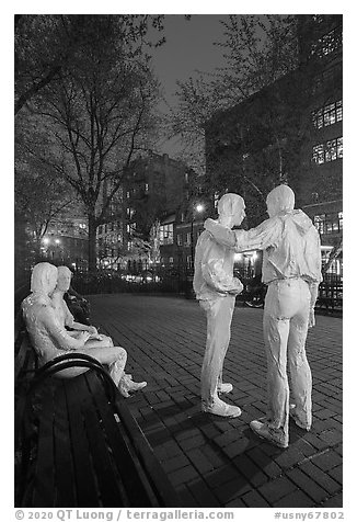 Gay Liberation sculpture by George Segal at night, Stonewall National Monument. NYC, New York, USA (black and white)