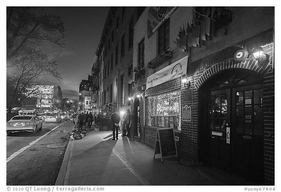 Christopher Street and Stonewall Inn at night, Stonewall National Monument. NYC, New York, USA (black and white)