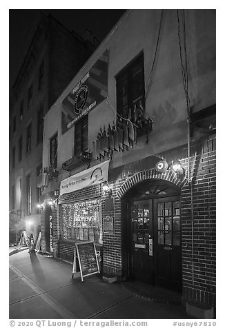 Stonewall Inn building at night, Stonewall National Monument. NYC, New York, USA (black and white)