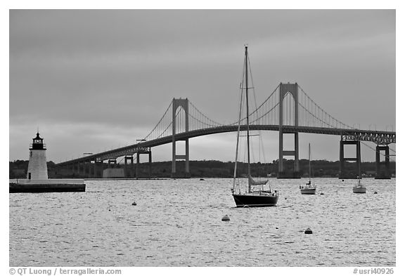 Newport Bridge and Newport Harbor lighthouse at sunset. Newport, Rhode Island, USA (black and white)