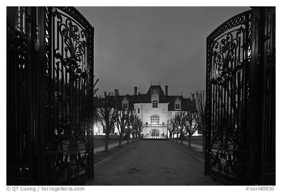 Entrance gate and historic mansion building at night. Newport, Rhode Island, USA (black and white)
