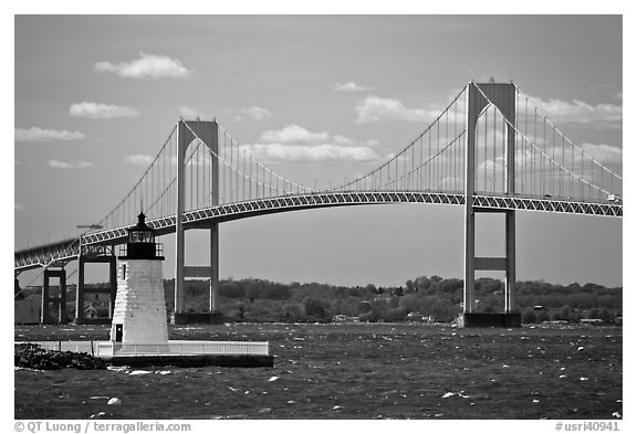 Newport Harbor lighthouse, Newport Bridge, and Narragansett Bay. Newport, Rhode Island, USA (black and white)