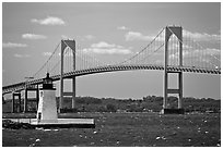 Newport Harbor lighthouse, Newport Bridge, and Narragansett Bay. Newport, Rhode Island, USA (black and white)