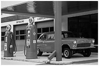 Vintage gas pumps and car, Deadwood. Black Hills, South Dakota, USA (black and white)