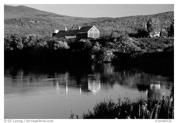 Red barns reflected in Line Pond near Pomfret. Vermont, New England, USA (black and white)