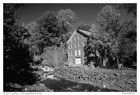 Old Mill next to a cascading brook near Stowe. Vermont, New England, USA