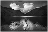 Thunderstorm clouds at sunrise reflected in reservoir. Hells Canyon National Recreation Area, Idaho and Oregon, USA (black and white)