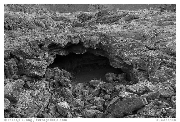 Entrance of lava tube. Craters of the Moon National Monument and Preserve, Idaho, USA (black and white)