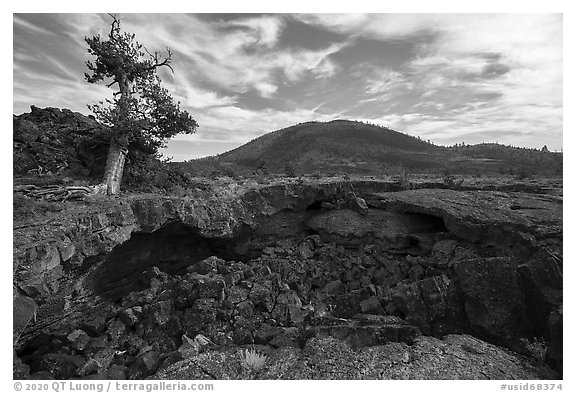 Buffalo Cave collpased roof and and Big Cinder Butte. Craters of the Moon National Monument and Preserve, Idaho, USA (black and white)