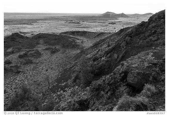 Echo Crater with Watchman cinder cone in the distance. Craters of the Moon National Monument and Preserve, Idaho, USA (black and white)