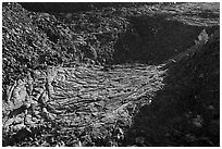 Former lava lake and tree, Pilar Butte. Craters of the Moon National Monument and Preserve, Idaho, USA ( black and white)