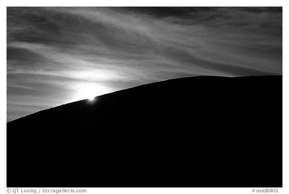 Sun at the rim of a cinder cone, sunrise, Craters of the Moon National Monument. Idaho, USA (black and white)