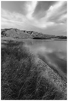Grassy river shore and bluffs near Wood Bottom. Upper Missouri River Breaks National Monument, Montana, USA ( black and white)