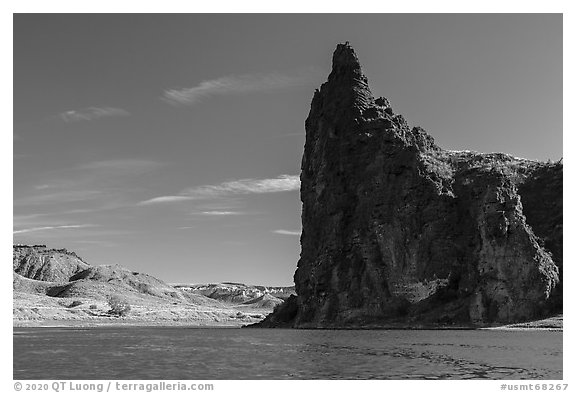 Dark igneous plug at the edge of river. Upper Missouri River Breaks National Monument, Montana, USA (black and white)