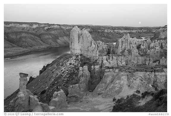 Sandstone pinnacles and moon. Upper Missouri River Breaks National Monument, Montana, USA