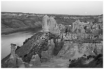 Sandstone pinnacles and moon. Upper Missouri River Breaks National Monument, Montana, USA ( black and white)