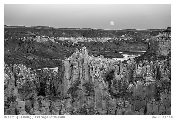 Spires, Missouri River, and moon, Hole-in-the-Wall. Upper Missouri River Breaks National Monument, Montana, USA (black and white)