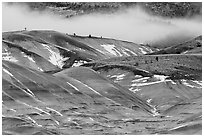 Painted hills with snow and fog. John Day Fossils Bed National Monument, Oregon, USA ( black and white)